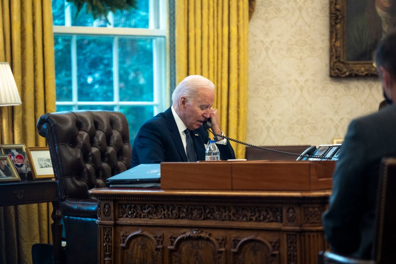 WASHINGTON, DC - DECEMBER 09: U.S. President Joe Biden talks on the phone with Ukrainian President Volodymyr Zelensky from the Oval Office at the White House on December 09, 2021 in Washington, DC. According to the White House, Biden and Zelensky discussed Russia’s military build-up on Ukraine’s borders.