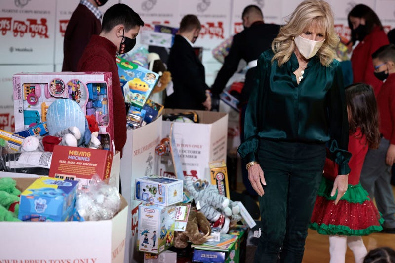 First Lady Dr. Jill Biden helps children during a sorting event for the annual Marine Toys for Tots Drive at the Joint Base Myer–Henderson Hall on December 10, 2021 in Fort Myer, Virginia. In the year 2020, Toys for Tots, which was founded in 1947, served 7.4 million children with 20 million toys. (Photo by Anna Moneymaker/Getty Images)