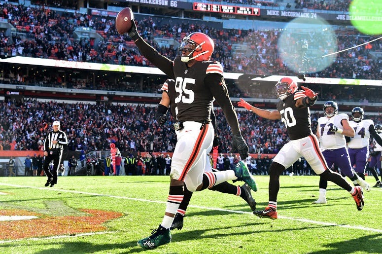 Myles Garrett celebrates after running the ball in for a touchdown after a fumble recovery against the Baltimore Ravens