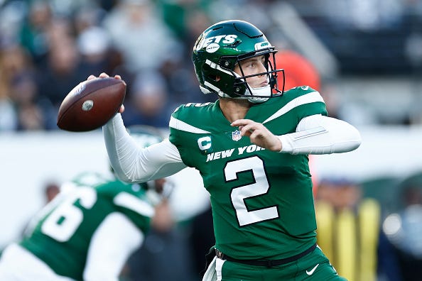 Zach Wilson models the Jets green uniform tops. 