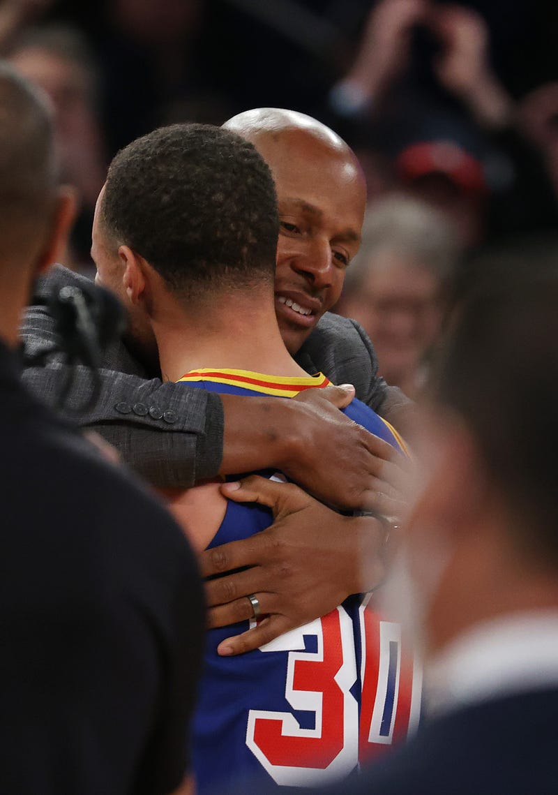 Stephen Curry #30 of the Golden State Warriors hugs Ray Allen after making a three point basket to break Allen’s record for the most all-time against the New York Knicks during their game at Madison Square Garden on December 14, 2021 in New York City.