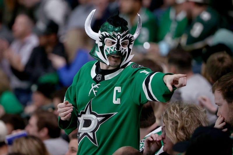 A fan cheers as the Dallas Stars take on the St. Louis Blues in the third period at American Airlines Center on December 14, 2021 in Dallas, Texas.