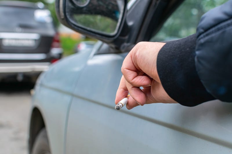 Person smoking a joint while driving.