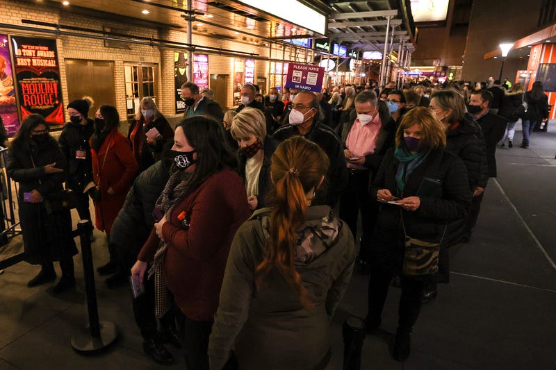 Theater-goers wear masks while in line to see "To Kill a Mockingbird"