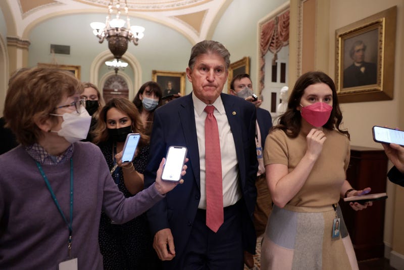 Sen. Joe Manchin (D-WV) is followed by reporters as he leaves a caucus meeting with Senate Democrats at the U.S. Capitol Building on December 17, 2021 in Washington, DC. Democrats continue to work on a path forward in regards to the Build Back Better and election reform legislation ahead of the Holiday recess. (Photo by Anna Moneymaker/Getty Images)