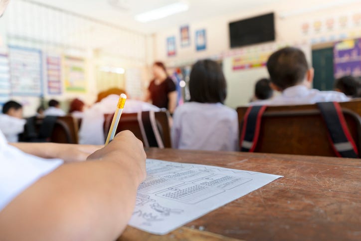 Students in class taking a test. 