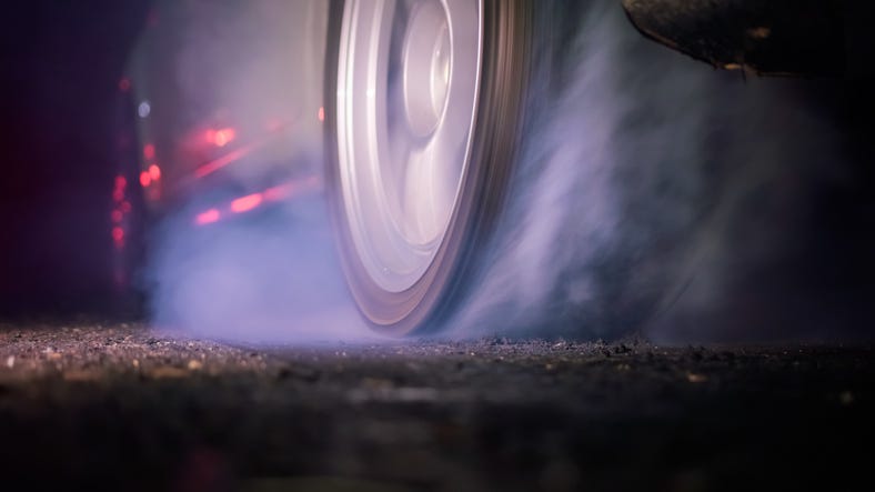 Drag racing car peeling out