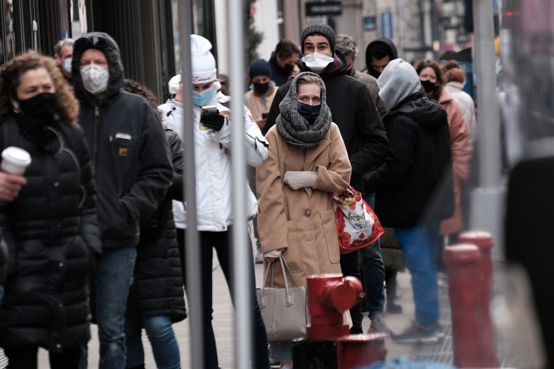People wait in long lines in Manhattan to get tested for COVID-19 on Dec. 22, 2021