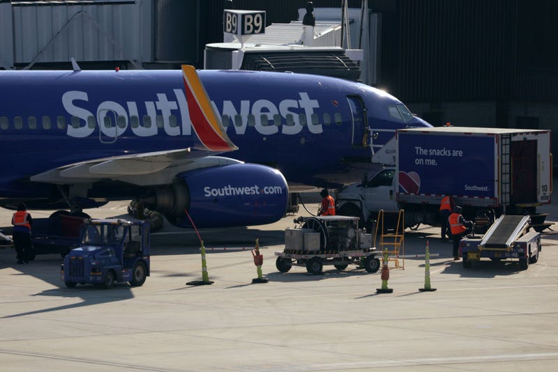 A ground crew replenishes a Southwest Airlines aircraft at Baltimore/Washington International Thurgood Marshall Airport (BWI) on December 22, 2021 in Baltimore, Maryland. 
