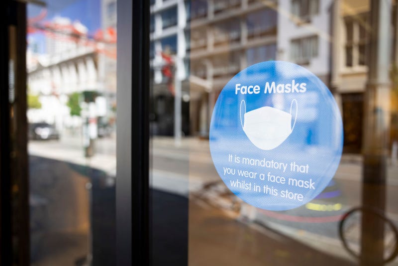 A sign on display advises the public to the requirements of face masks on December 24, 2021 in Perth, Australia.