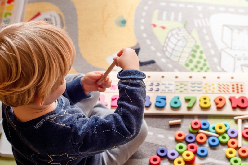 A kid plays a game in daycare