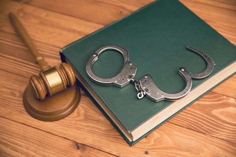 hammer and handcuffs on the table