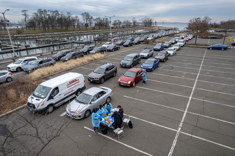 In an aerial view, health workers administer Covid-19 PCR tests at an outdoor testing site aside the Long Island Sound on December 28, 2021 in Stamford, Connecticut