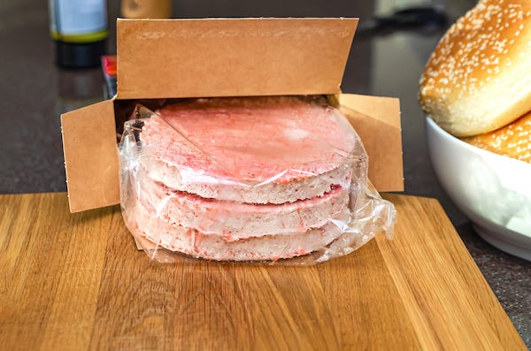 Frozen burger patties before cooking