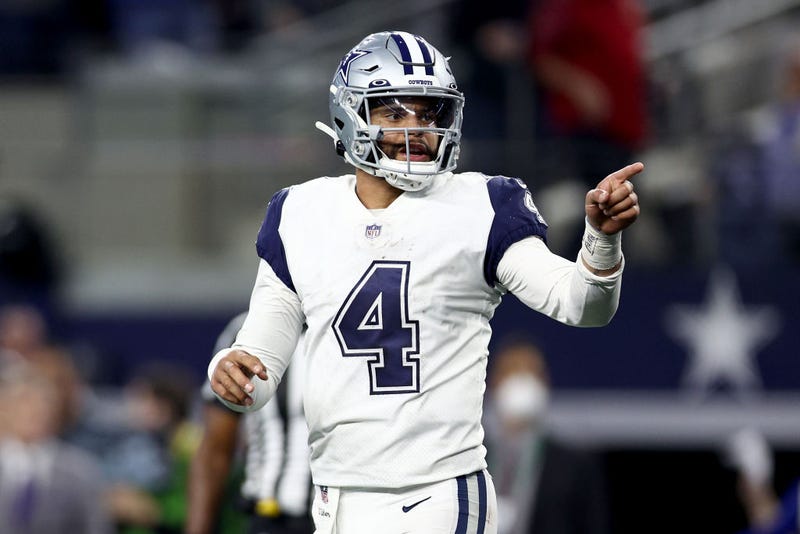 Dak Prescott #4 of the Dallas Cowboys reacts after completing a pass against the Arizona Cardinals in the fourth quarter at AT&T Stadium on January 02, 2022 in Arlington, Texas.