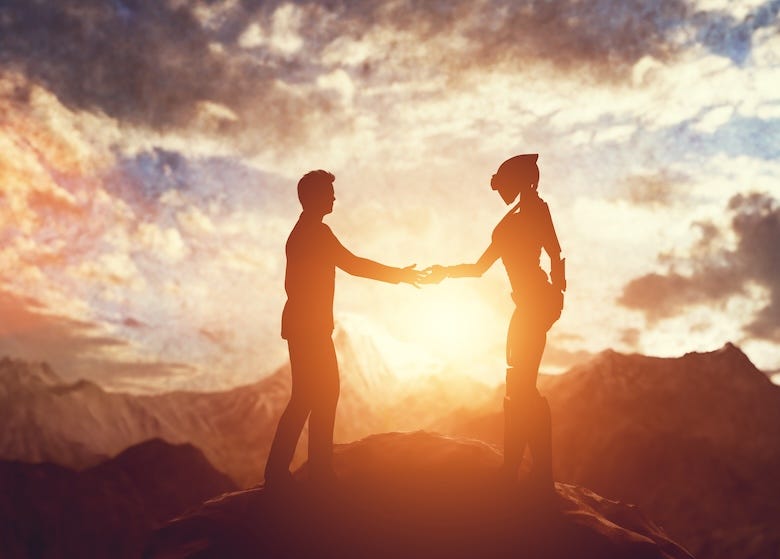 Human and alien shaking hands