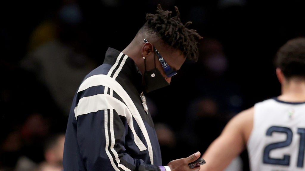 Antonio Brown sits courtside at Grizzlies-Nets the day after Bucs exit