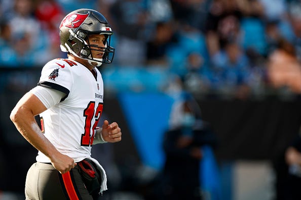 Tom Brady models the Buccaneers white uniform tops. 