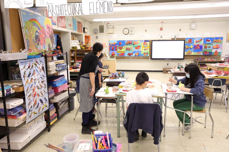 An art teacher gives students a lesson in her classroom in Lower Manhattan this year