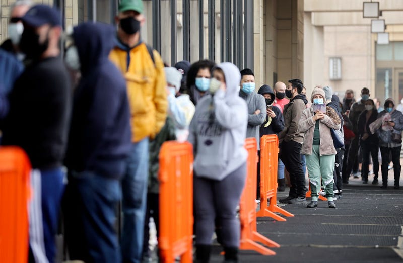 People wait in line to be tested for COVID-19 at Union Station.