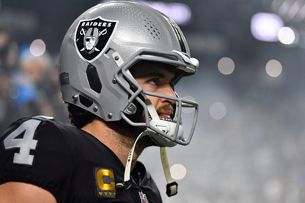 Derek Carr models the Raiders black uniform tops. 