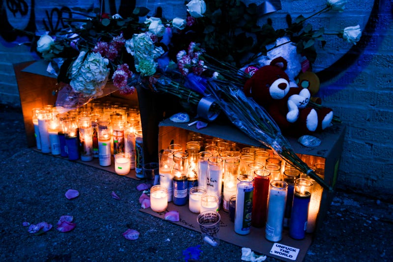 Candles are seen in a makeshift memorial near of the apartment building days after a deadly fire in the Bronx.