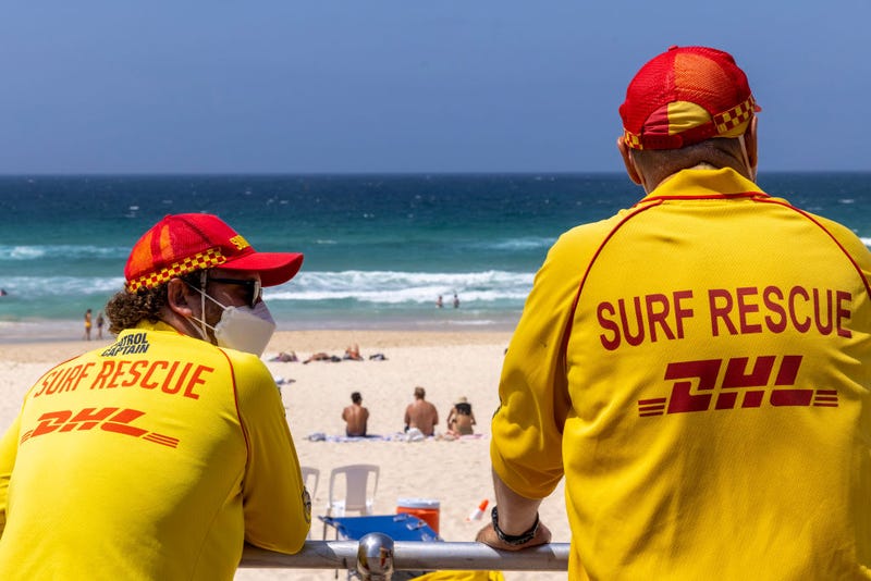 Surf rescue workers look on at Bondi Beach on January 16, 2022 in Sydney, Australia. The Nutri-Grain IronMan & IronWoman Series held at Bondi Beach were cancelled and beaches along Australia's Queensland and New South Wales coast are closed due to a tsunami warning after an undersea volcano erupted off Tonga.