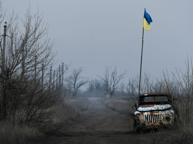 War in Eastern Ukraine with a flag planted. 