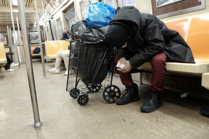 A man sleeps in a subway car in Manhattan on January 19, 2022 in New York City.
