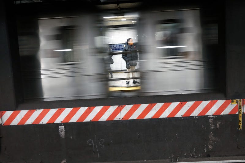 People wait for a train in a subway station on January 19, 2022 in New York City.