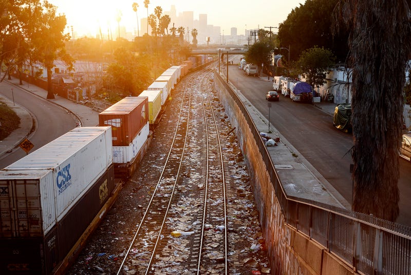  Union Pacific freight train passes along a section of tracks littered with debris from packages stolen from cargo containers stacked on rail cars on January 19, 2022 in Los Angeles, California. The area has seen numerous thefts of the containers aboard trains which sometimes are required to stop in the area on their way to other destinations. Union Pacific has seen a 160 percent increase in rail thefts in Los Angeles County over the past year. Many of the packages are from Amazon and other retailers. (