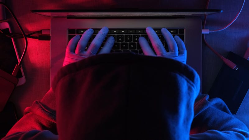 hacker working on laptop