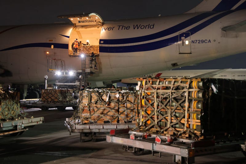 Ground personnel unload weapons, including Javelin anti-tank missiles, and other military hardware delivered on a National Airlines plane by the United States military at Boryspil Airport near Kyiv on January 25, 2022 in Boryspil, Ukraine. The shipment comes as tensions between the NATO military alliance and Russia are intensifying due to Russia's move of tens of thousands of troops as well as heavy weapons to the Ukrainian border, causing international fears of a possible Russian invasion of Ukraine. The U.S., Great Britain and other NATO countries have sent arms in recent days to Ukraine in a bid to deter an invasion. (Photo by Sean Gallup/Getty Images)