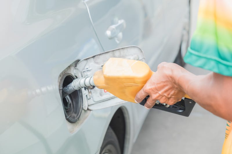 Man pumping gasoline oil