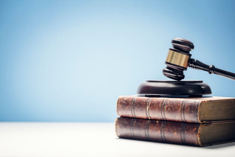 Judge gavel and law books in court.