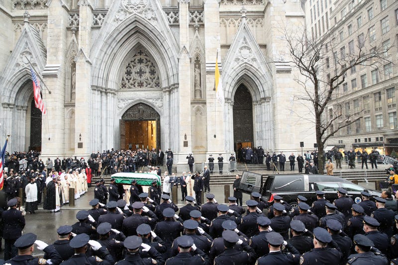 The casket of fallen NYPD Officer Jason Rivera is brought out of St. Patrick's Cathedral during his funeral on January 28, 2022 in New York City.