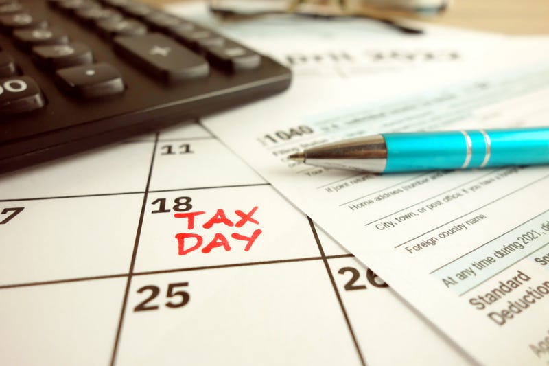 A calendar marked with Tax Day on April 18, 2022.
