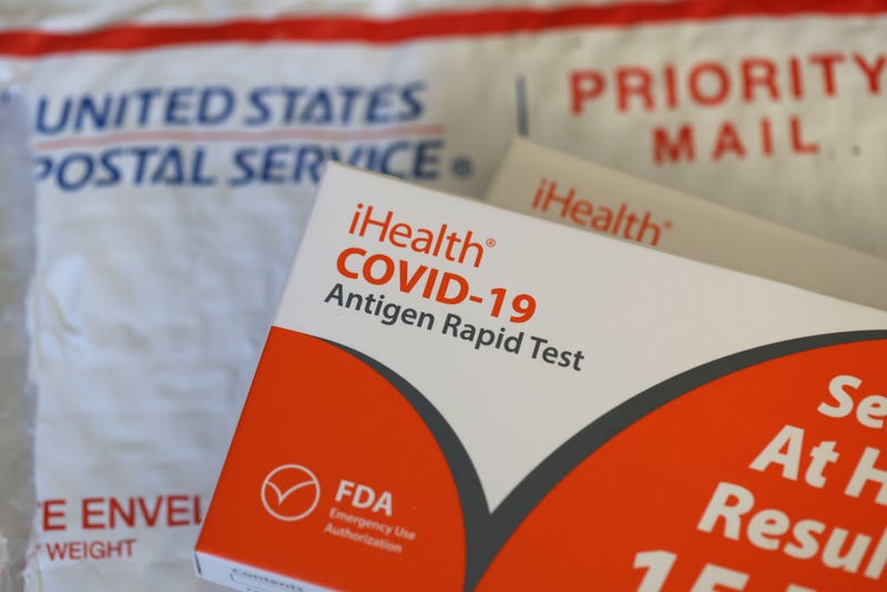 In this photo illustration, free iHealth COVID-19 antigen rapid tests from the federal government sit on a U.S. Postal Service envelope after being delivered on February 04, 2022 in San Anselmo, California. 