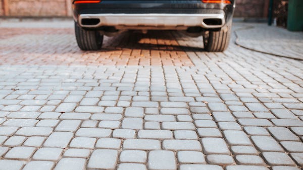 Couple fined $1,500 for parking their car in own driveway