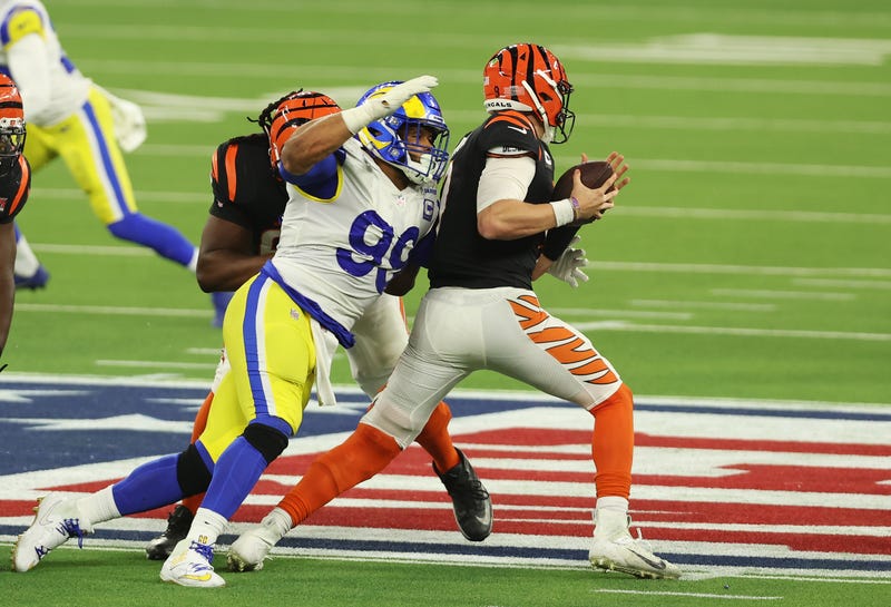 Joe Burrow #9 of the Cincinnati Bengals is sacked by Aaron Donald #99 of the Los Angeles Rams in the fourth quarter during Super Bowl LVI at SoFi Stadium on February 13, 2022 in Inglewood, California.