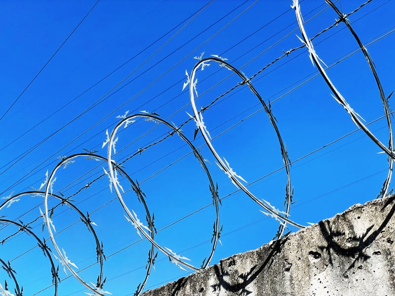 Barbed wire fence for a prison or jail.