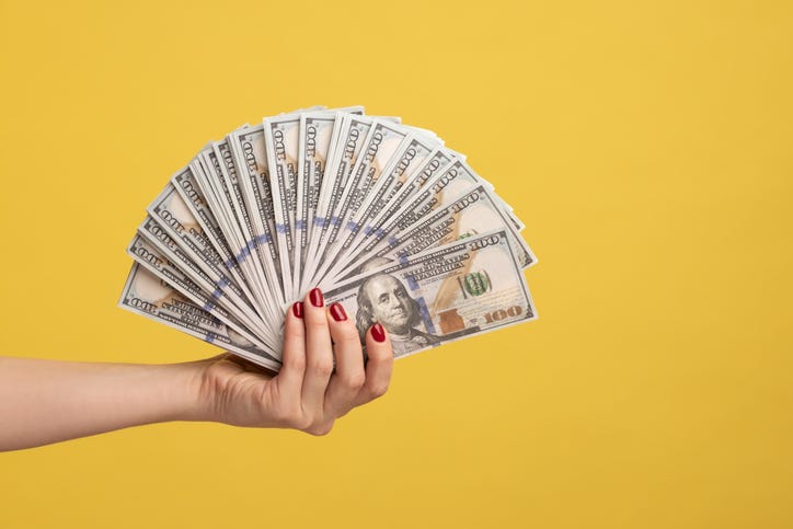 money in a woman's hand