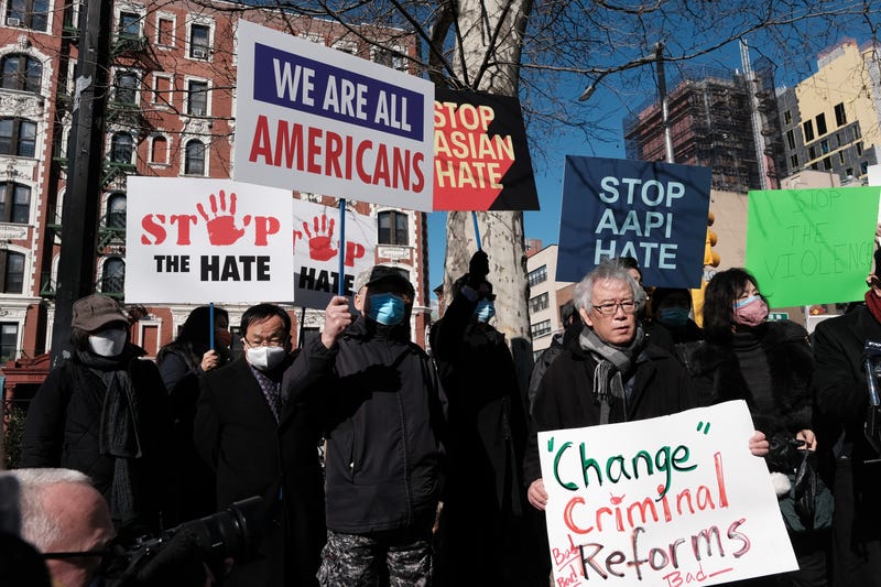 Members of the Korean American Association and others hold a rally and news conference Feb. 15, 2022, near the building where Christina Yuna Lee was murdered