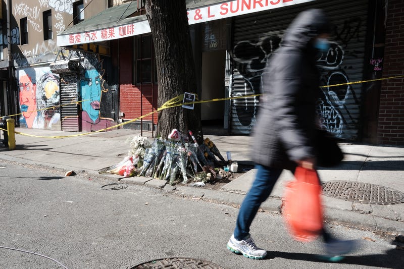 aFlowers are set outside Christina Yuna Lee's building Chinatown on Feb. 15, 2022