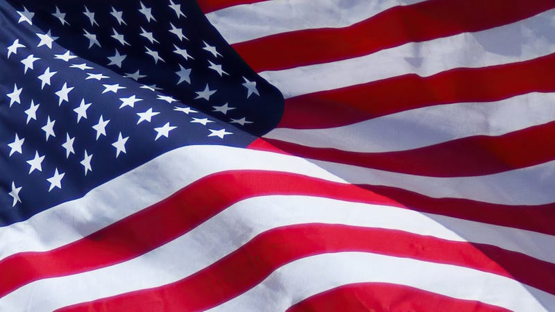 A close up of the US flag waving in the wind