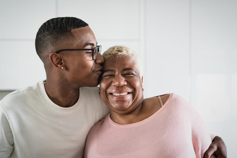 Happy mother and son portrait - Parents love and unity concept