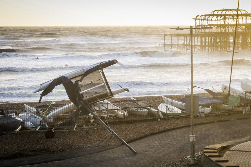 A boat is blown upside down on Brighton seafront on February 18, 2022 in Brighton, England. The Met Office has issued two rare, red weather warnings for the South and South West of England today as Storm Eunice makes landfall. Much of the rest of the UK is under amber and yellow warnings with winds up to 100 mph, rain and snow expected. This is the worst storm to hit the UK for three decades. (Photo by Tristan Fewings/Getty Images)