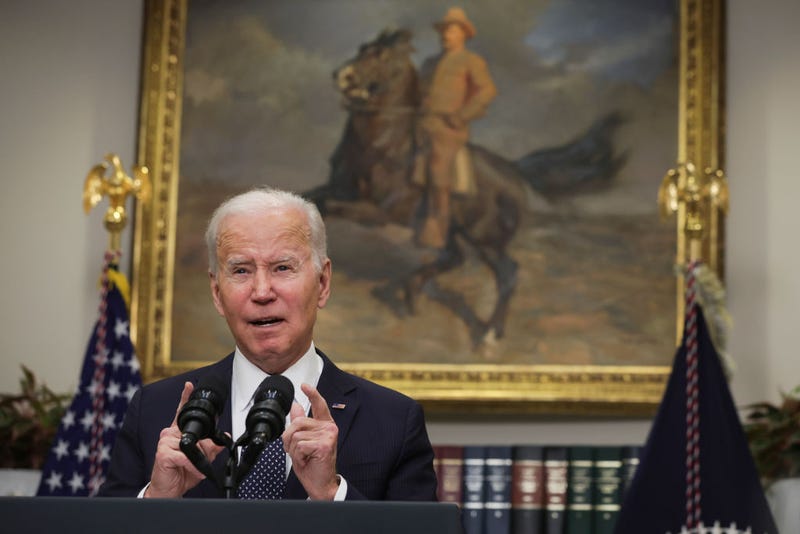 President Joe Biden at podium addressing media