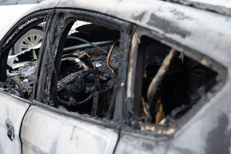 Close up of a burnt out car.