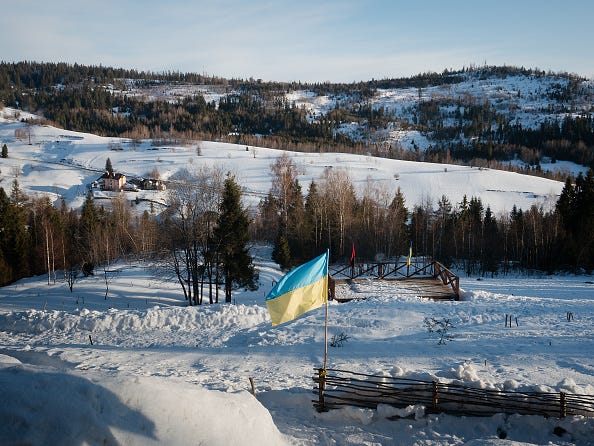 The Ukrainian flag and the flag of the Ukrainian Insurgent Army.